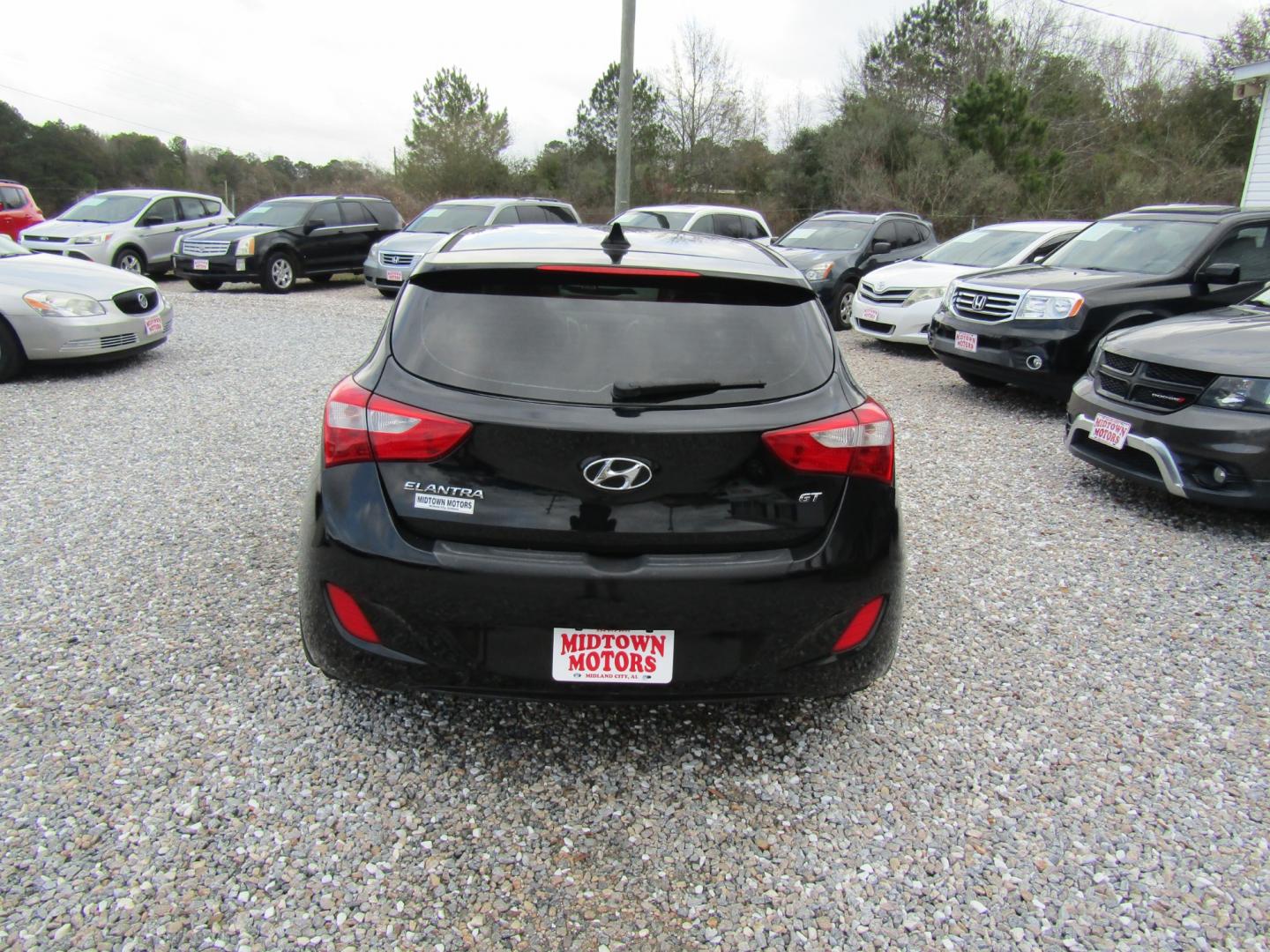 2013 Black Hyundai Elantra GT A/T (KMHD35LE1DU) with an 1.8L L4 16V DOHC engine, 6-Speed Automatic transmission, located at 15016 S Hwy 231, Midland City, AL, 36350, (334) 983-3001, 31.306210, -85.495277 - Photo#6